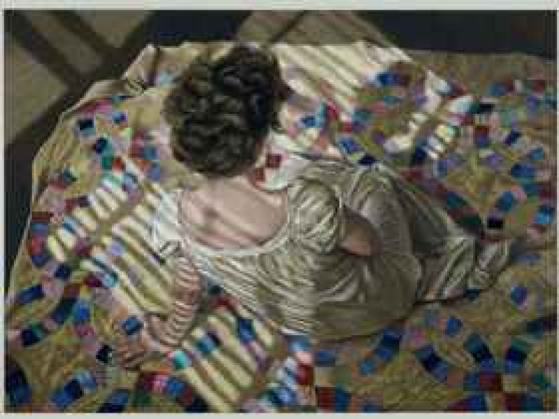 woman seated on a quilt by helen j_ vaughn.jpg